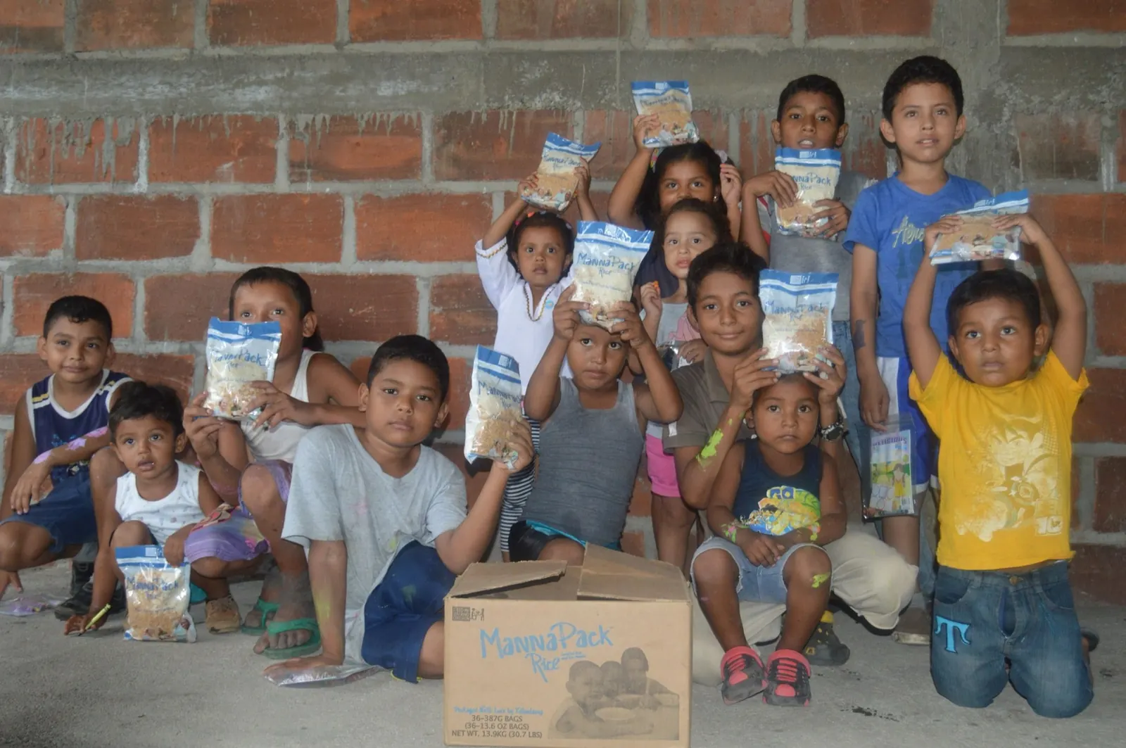 Children gathered through an On Eagles Wings Ministry feeding program