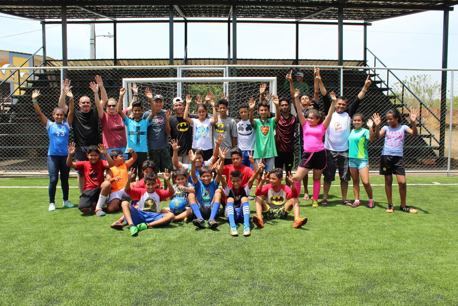 Youth soccer team with coaches at a sports ministry program